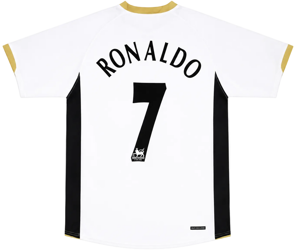 White back view of a soccer jersey with 'RONALDO' and the number '7' in black, featuring black side panels and gold trim on the collar and sleeve cuffs.