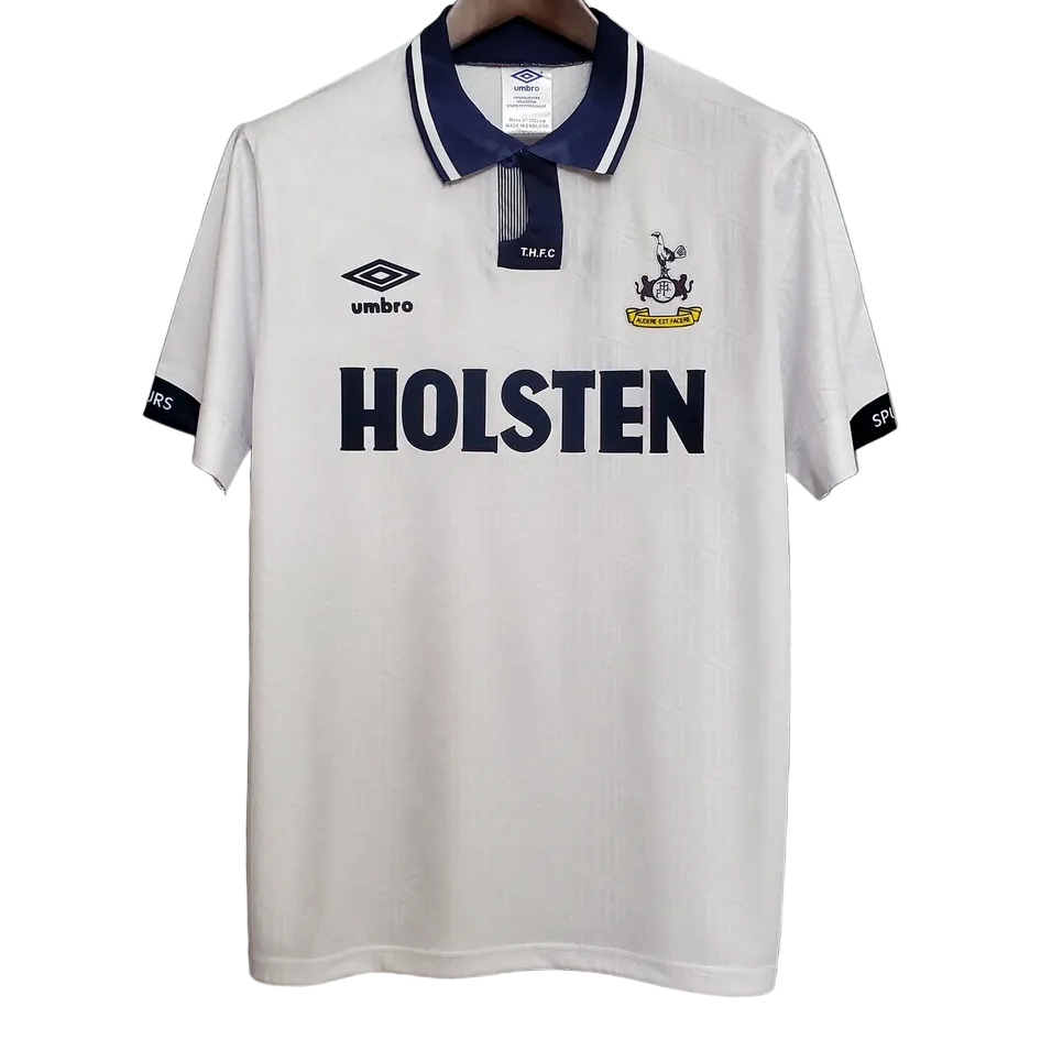 White polo shirt with 'Holsten' branding on a gray background