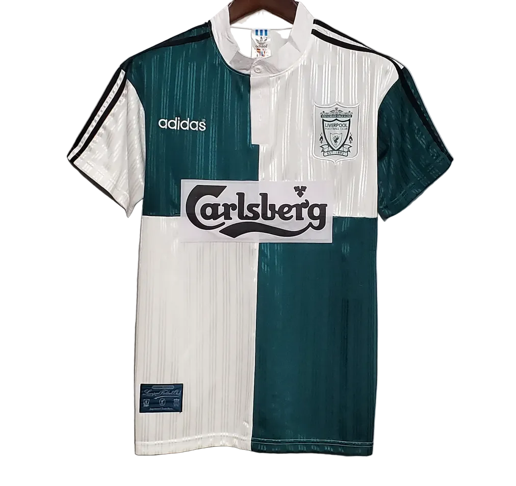 Green and white sports jersey with Adidas and Carlsberg logos on a gray background