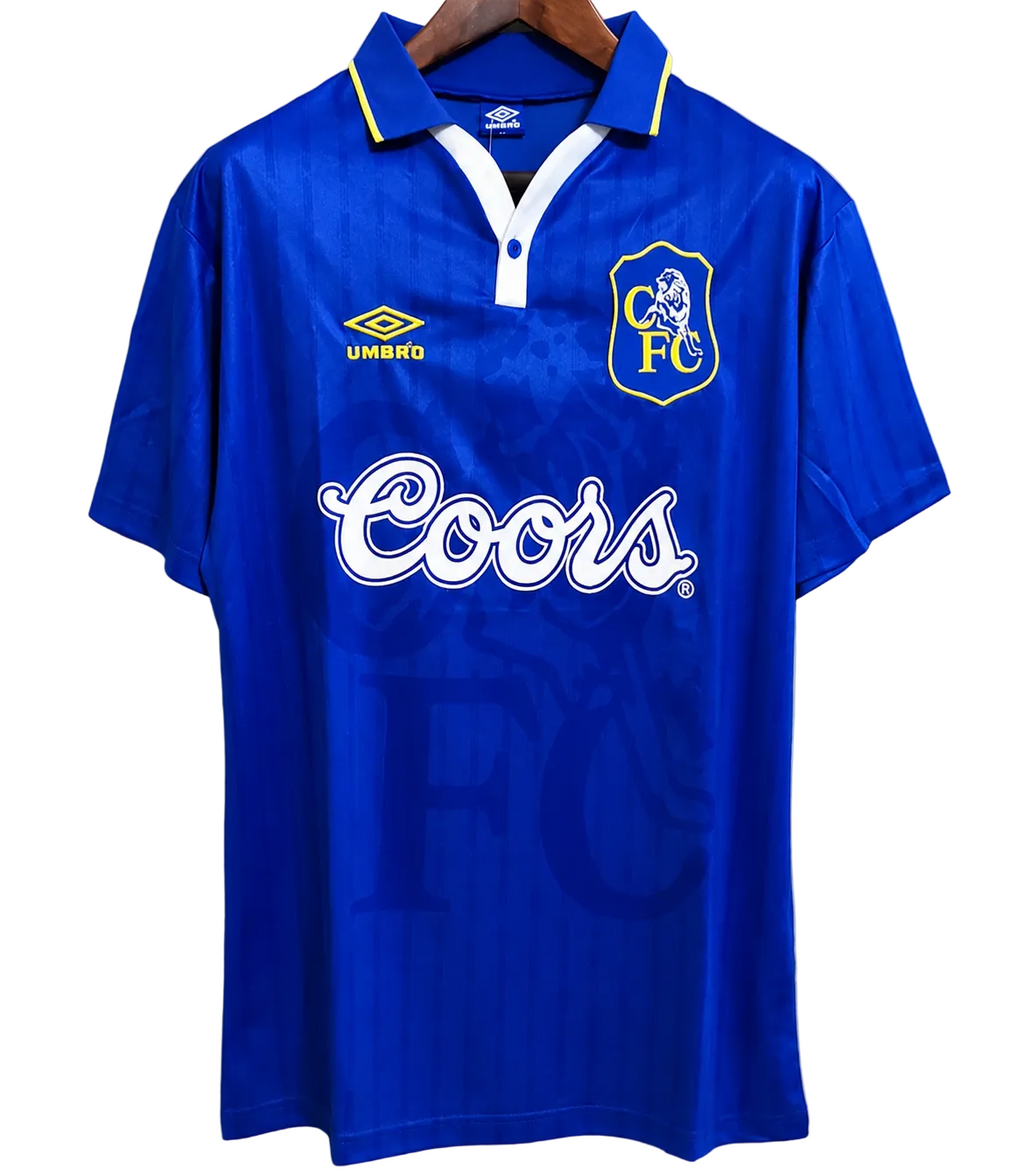 Blue sports jersey with Coors logo and Umbro branding on a gray background