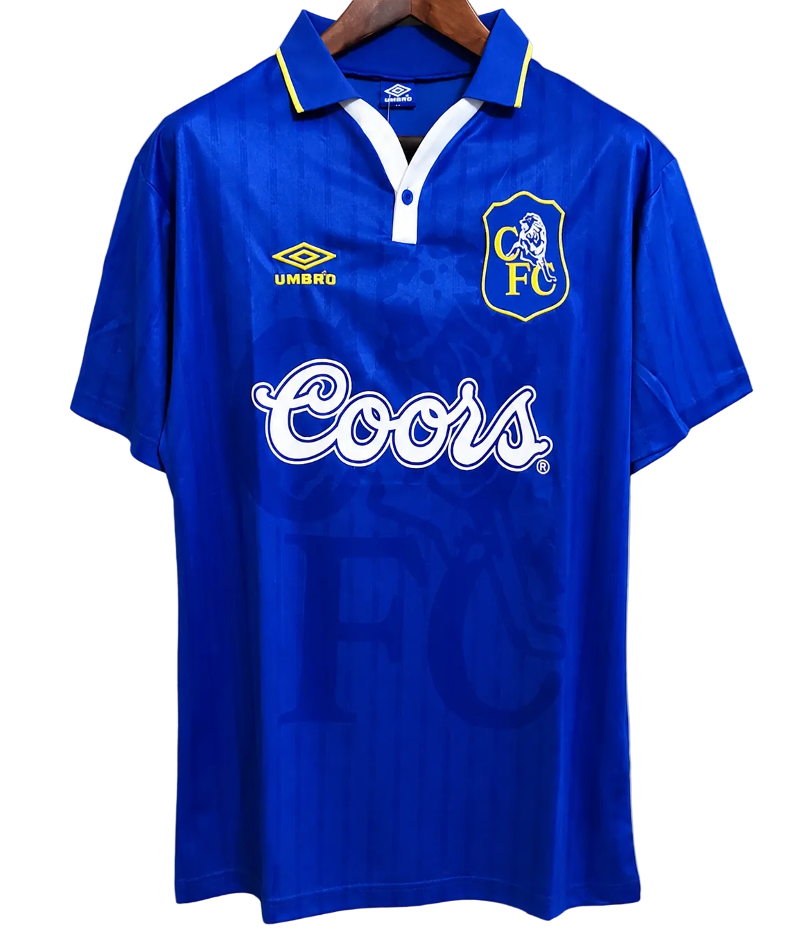 Blue sports jersey with Coors logo and Umbro branding on a gray background