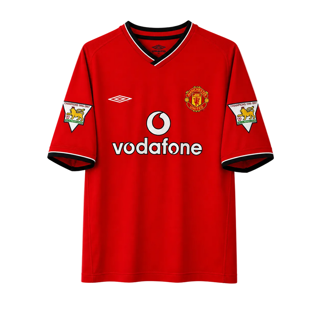 A red short-sleeve soccer jersey with black and white trim, featuring the Manchester United crest on the left chest, the Umbro logo on the right chest, and the Vodafone sponsor logo across the center.