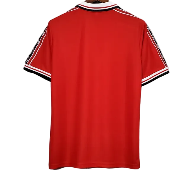 Red polo shirt with black and white stripes on a gray background