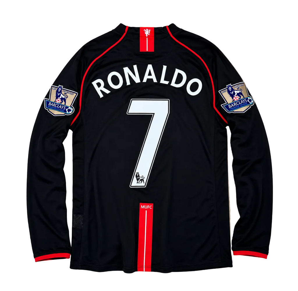 Black sports jersey with 'RONALDO 7' on a wooden surface