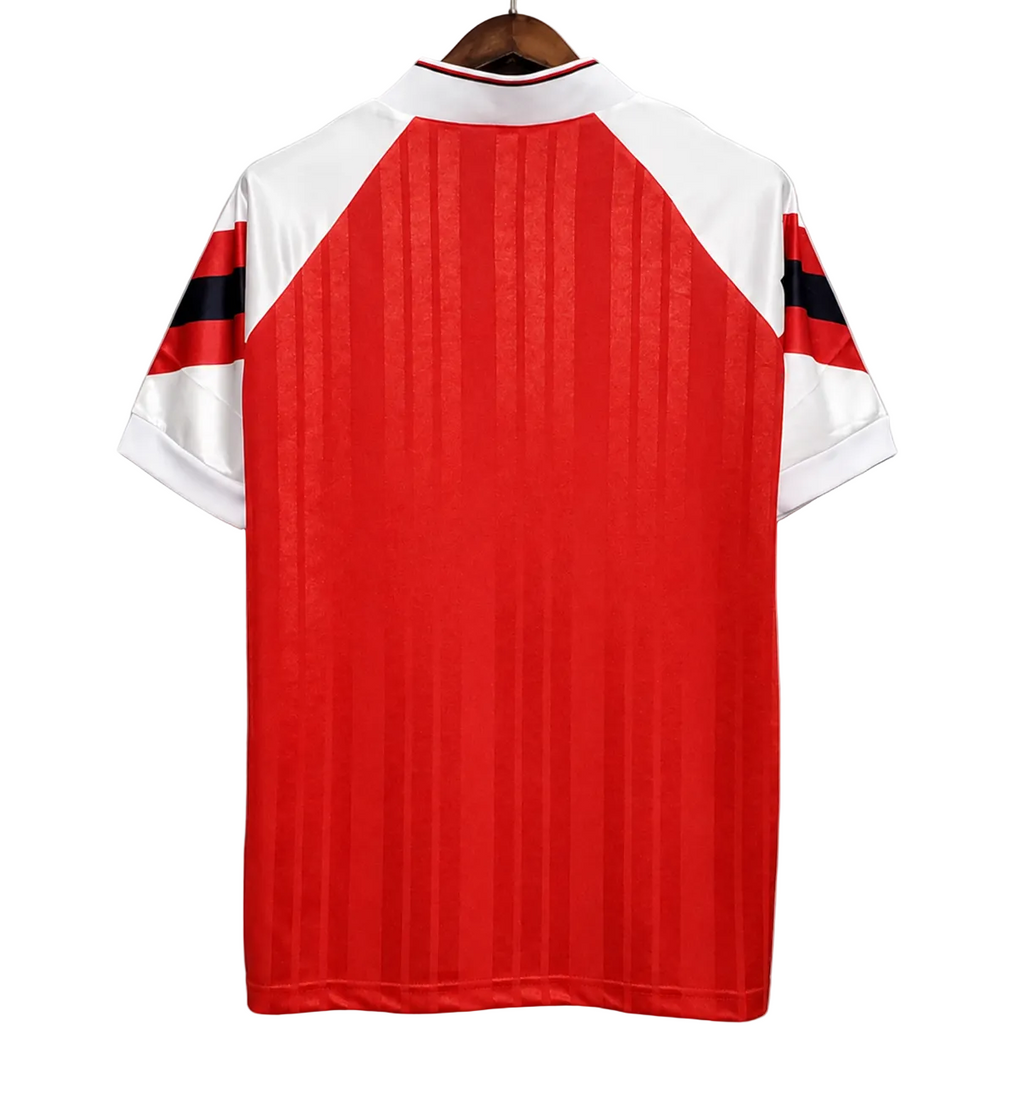 Red and white sports jersey with black accents on a gray background